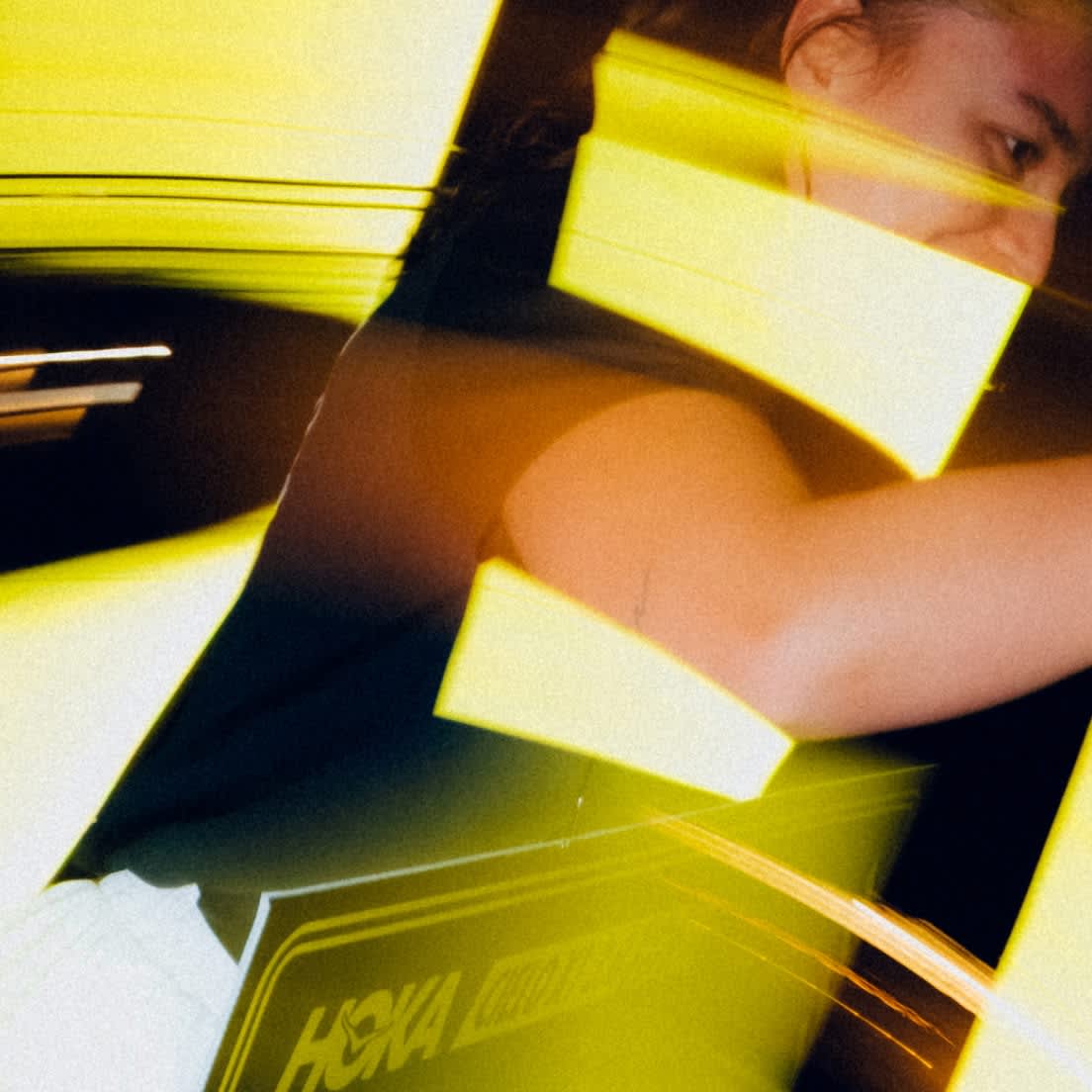 HOKA Lifestyle logo on a dynamic background