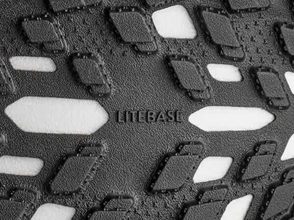 Shoe sole with black textured rubber, white cushioning, and embossed 'LITEBASE'.