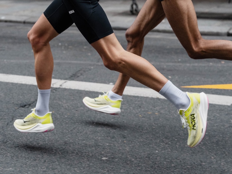 Overhead shot showing road runners featuring Strava logo