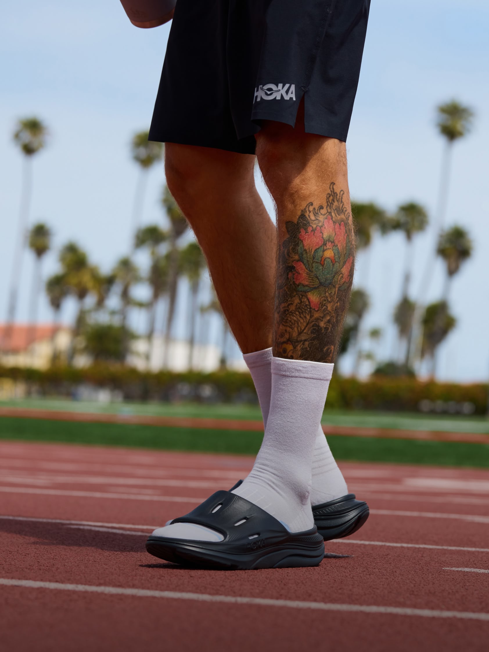 Campaign shot showing a close up of the HOKA Ora Recovery Slide 3.