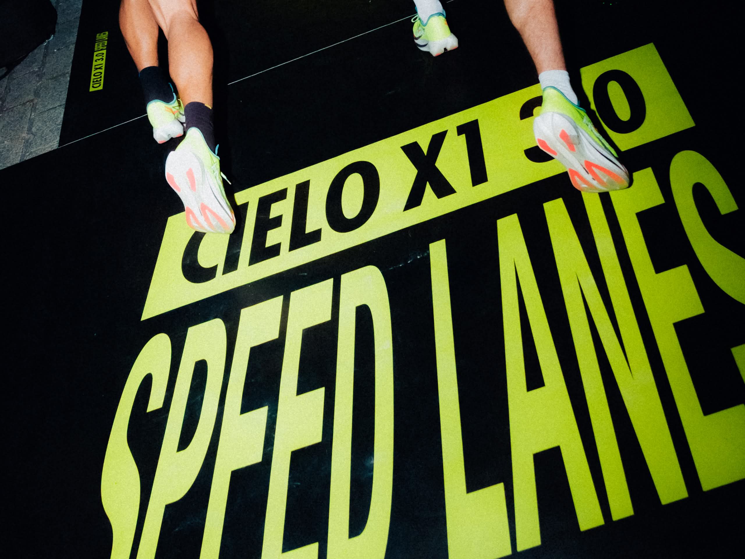 Photo of a HOKA Speed Lane, promoting the Cielo X1 3.0 at HOKA Semi de Paris, March 2026.