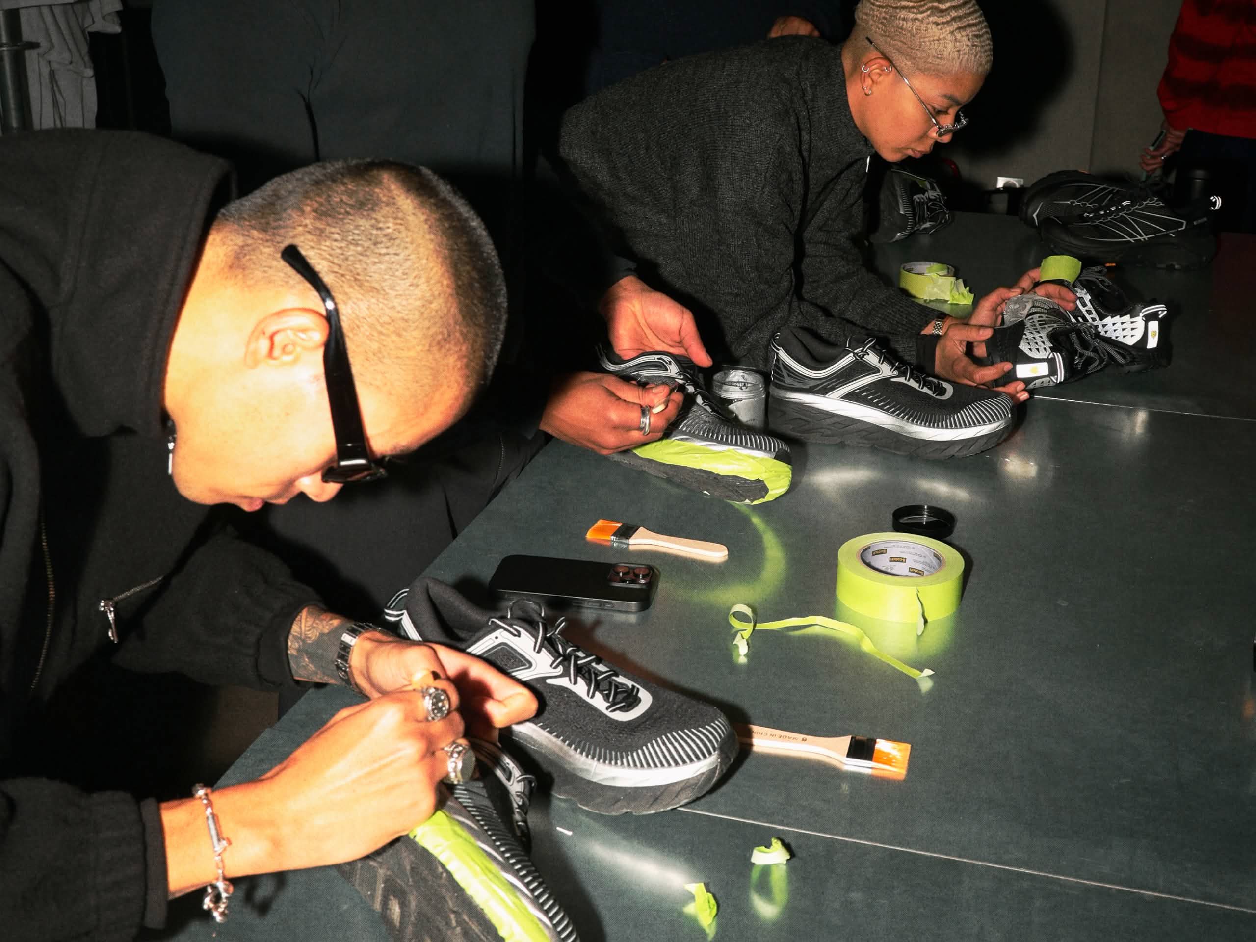 Photo showing the shoe personalisation station at the HOKA activation at Paris Fashion Week, January 2026.