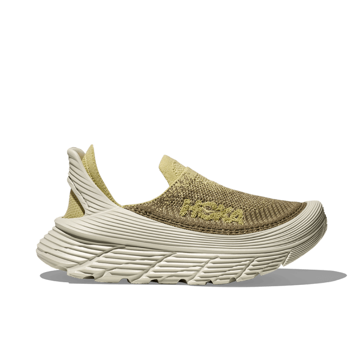 A product shot showing the HOKA Restore TC.