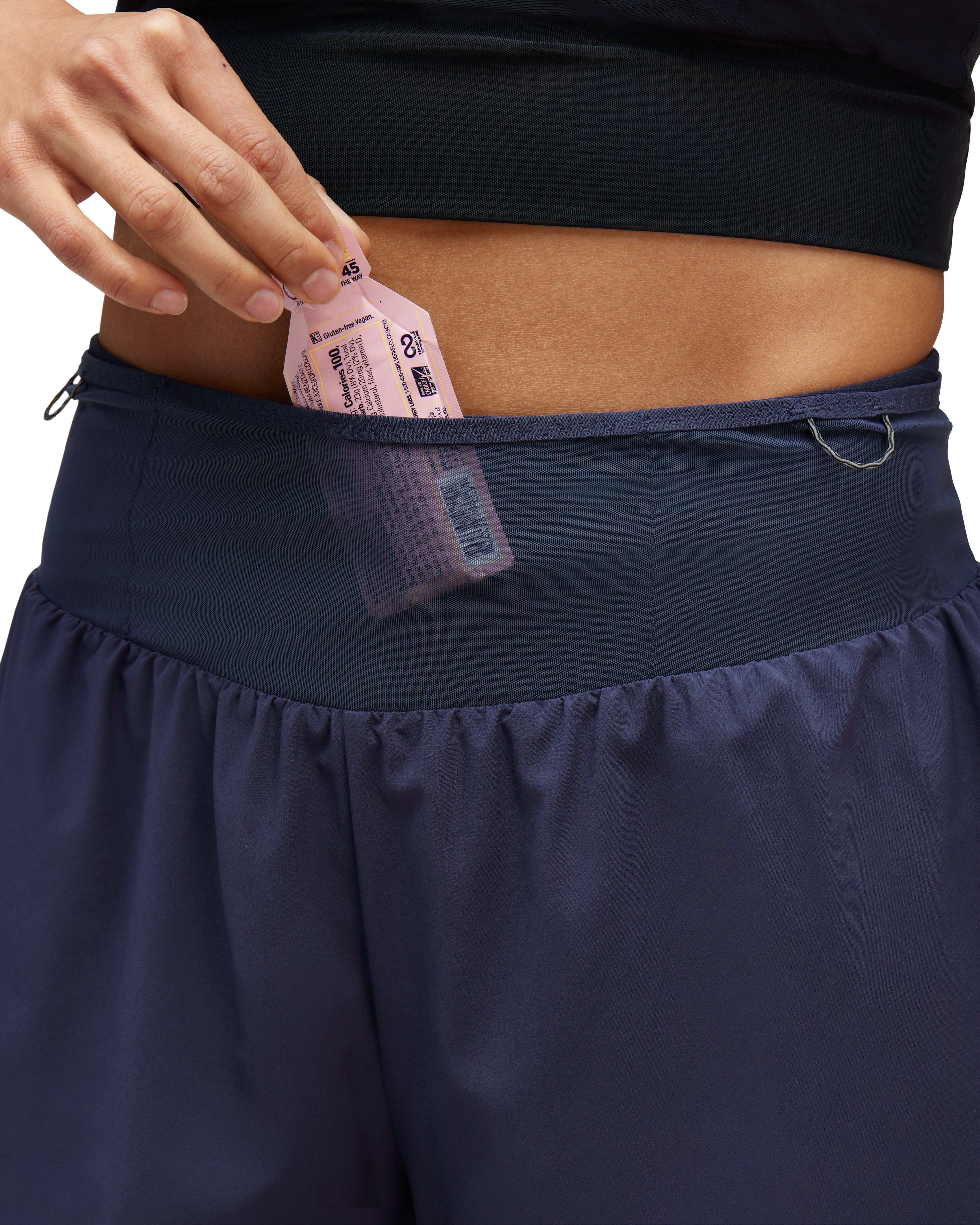 Mesh pockets at waist stash nutrition, keys, cards.
