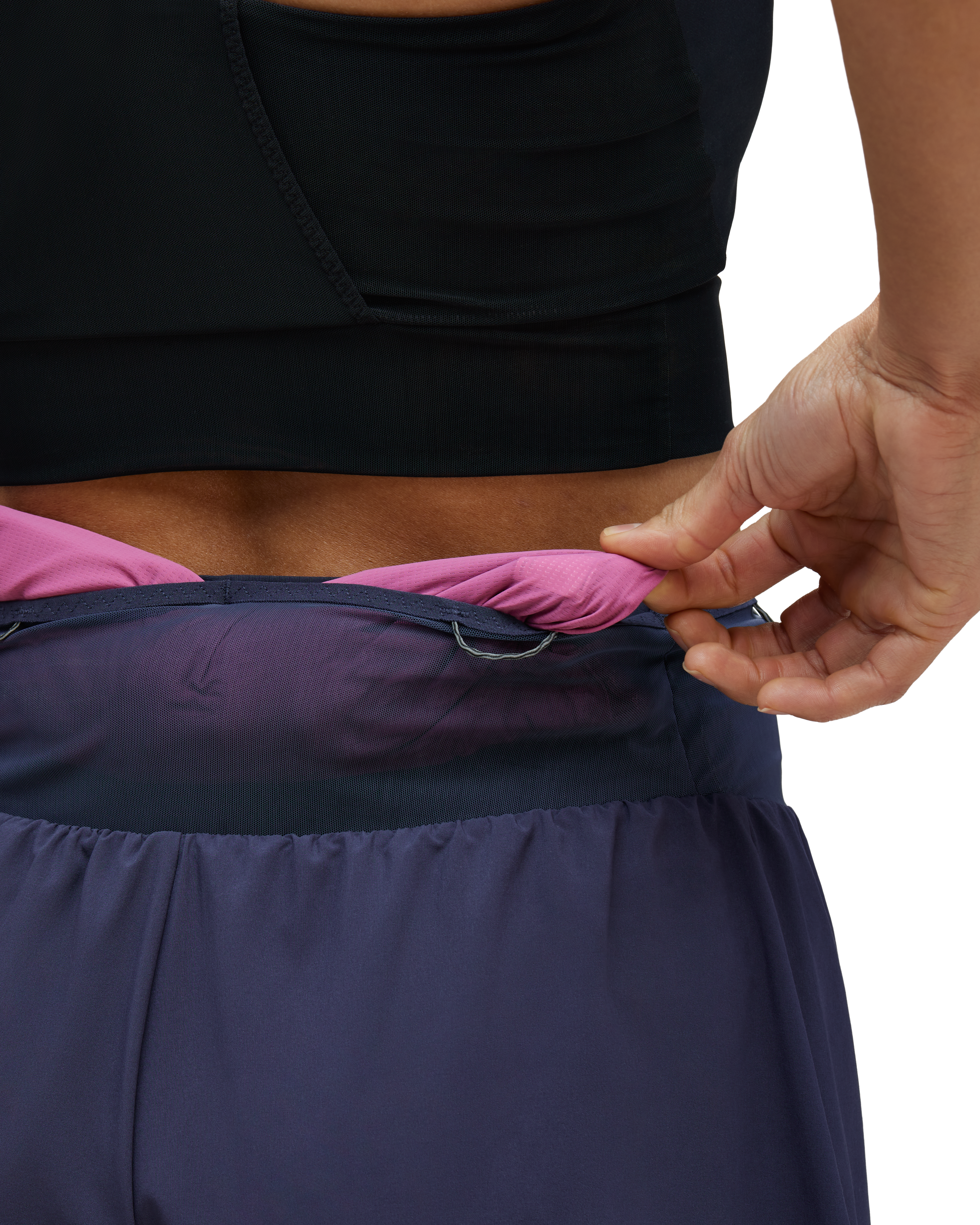Rear pass-through pocket holds discarded shirts.