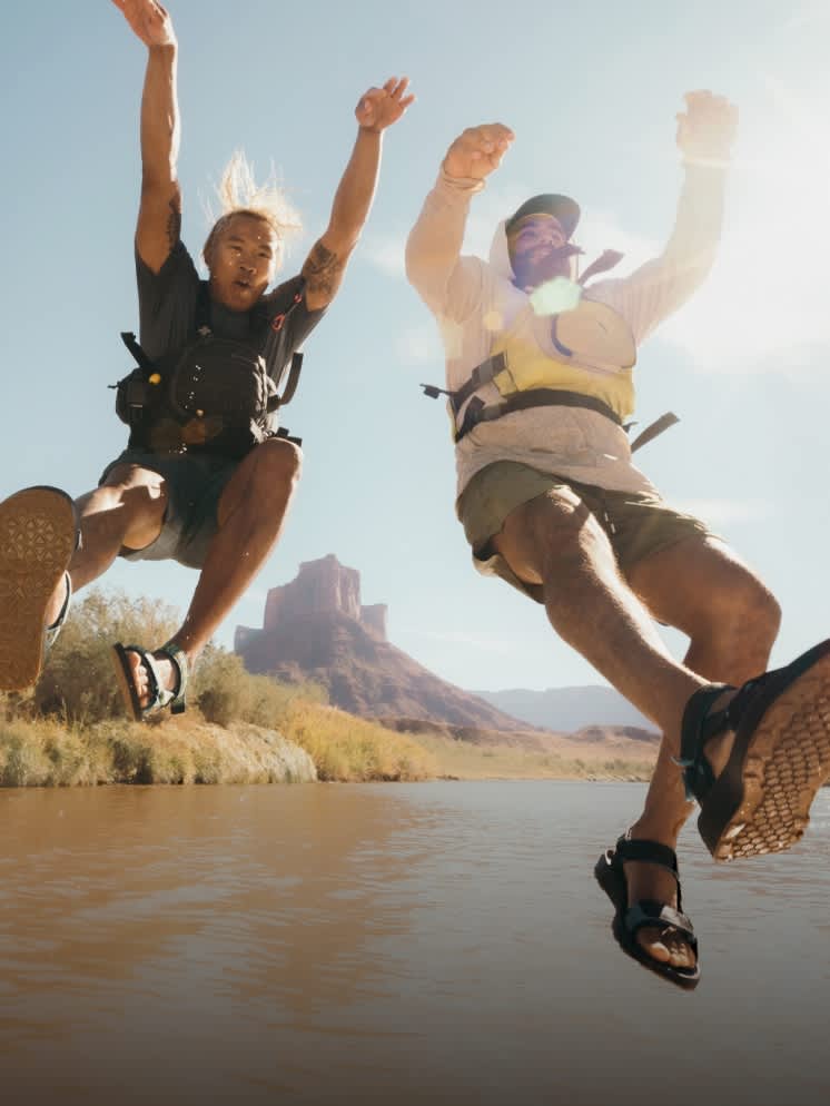 Two men jumping into the water Two men jumping into the water