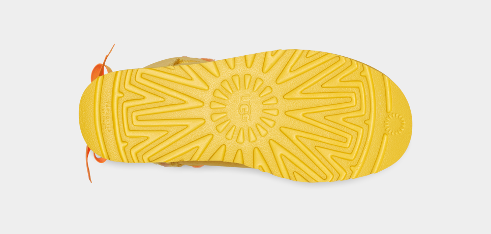 Yellow uggs with bows hotsell