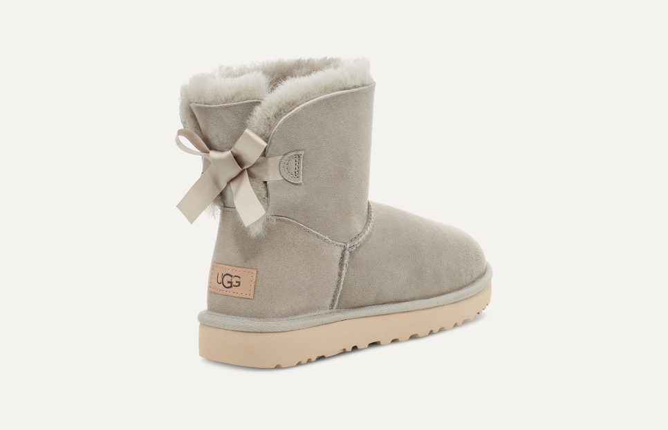 Ugg boots with pink ribbon top