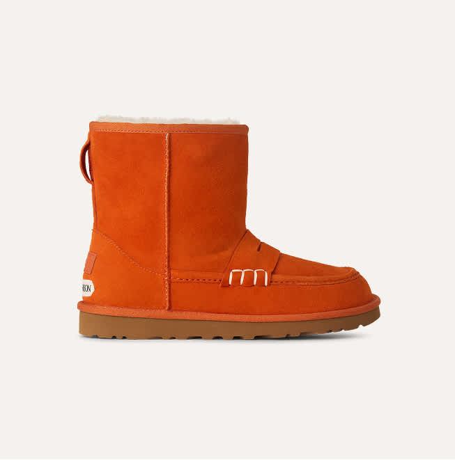 A studio shot of UGG JW Anderson loafer boot in orange.