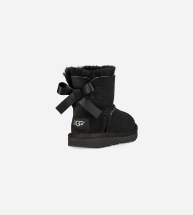 Botte UGG Mini Bailey Bow II pour enfant in Black, Taille 22, Daim