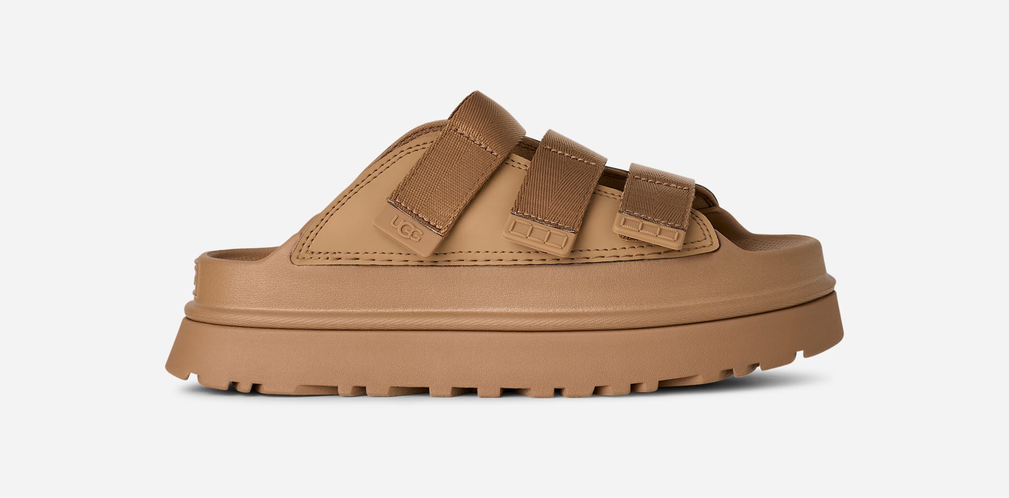 UGG® GoldenGlow Slide for Women in Dark Sand