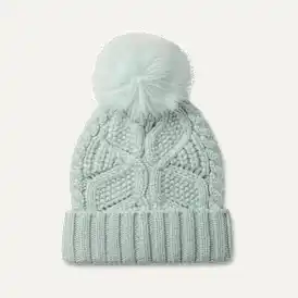 Bonnet en maille torsadée avec pompon